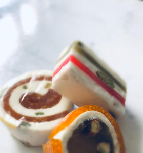 Apricot swirl nougat on a white marble table.